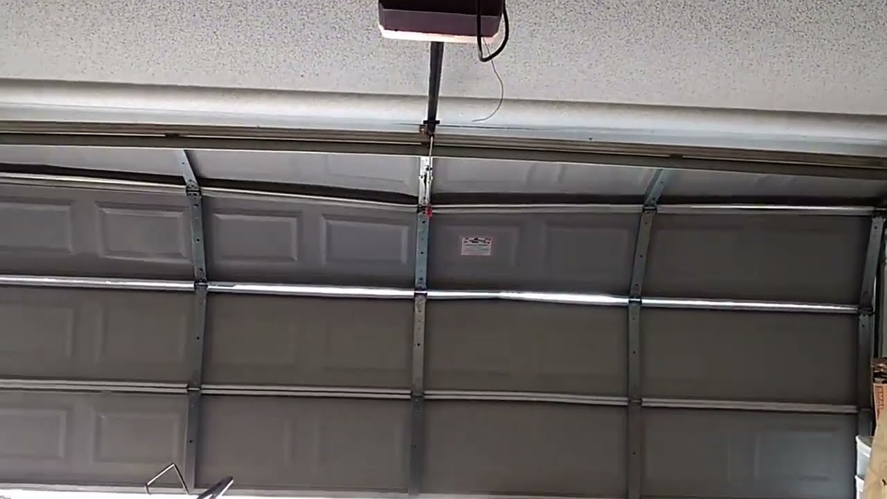 Why Your Garage Door Bends in the Middle When Opening (Solving the Mystery)